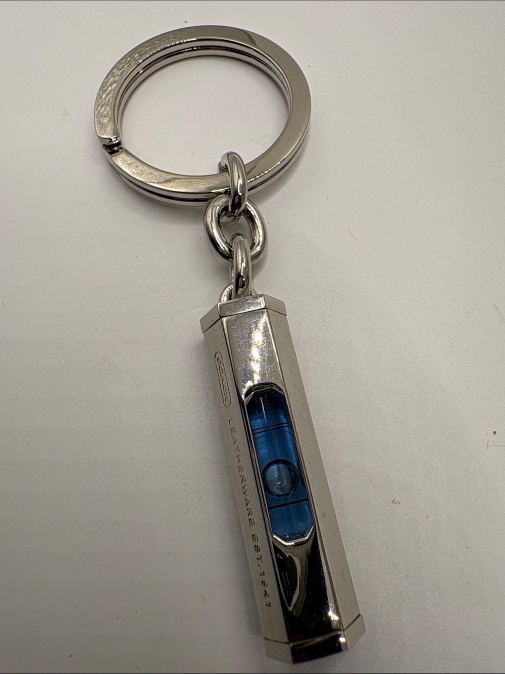Coach Silver Keychain Mini Bubble Level with Blue Vial